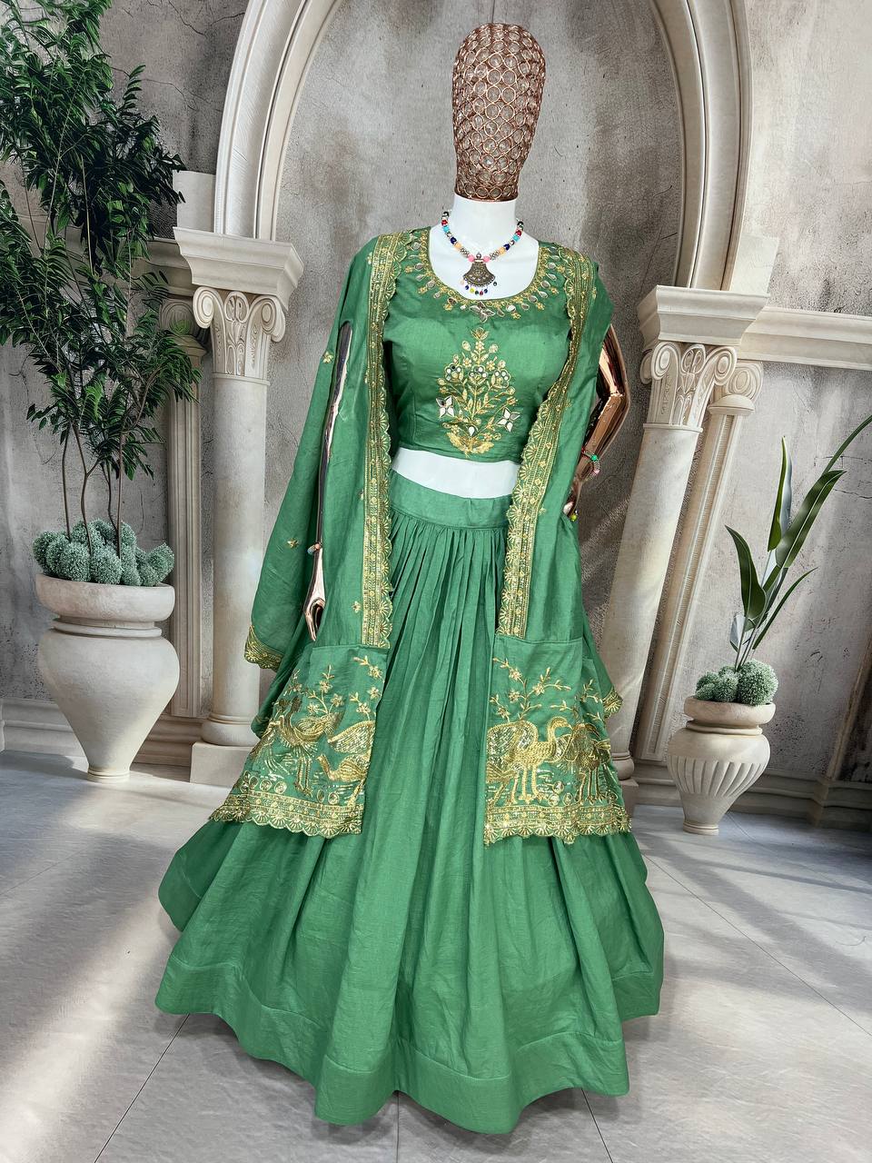 Emerald Green Silk Lehenga Choli with Golden Peacock Embroidery