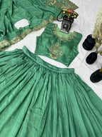 Emerald Green Silk Lehenga Choli with Golden Peacock Embroidery