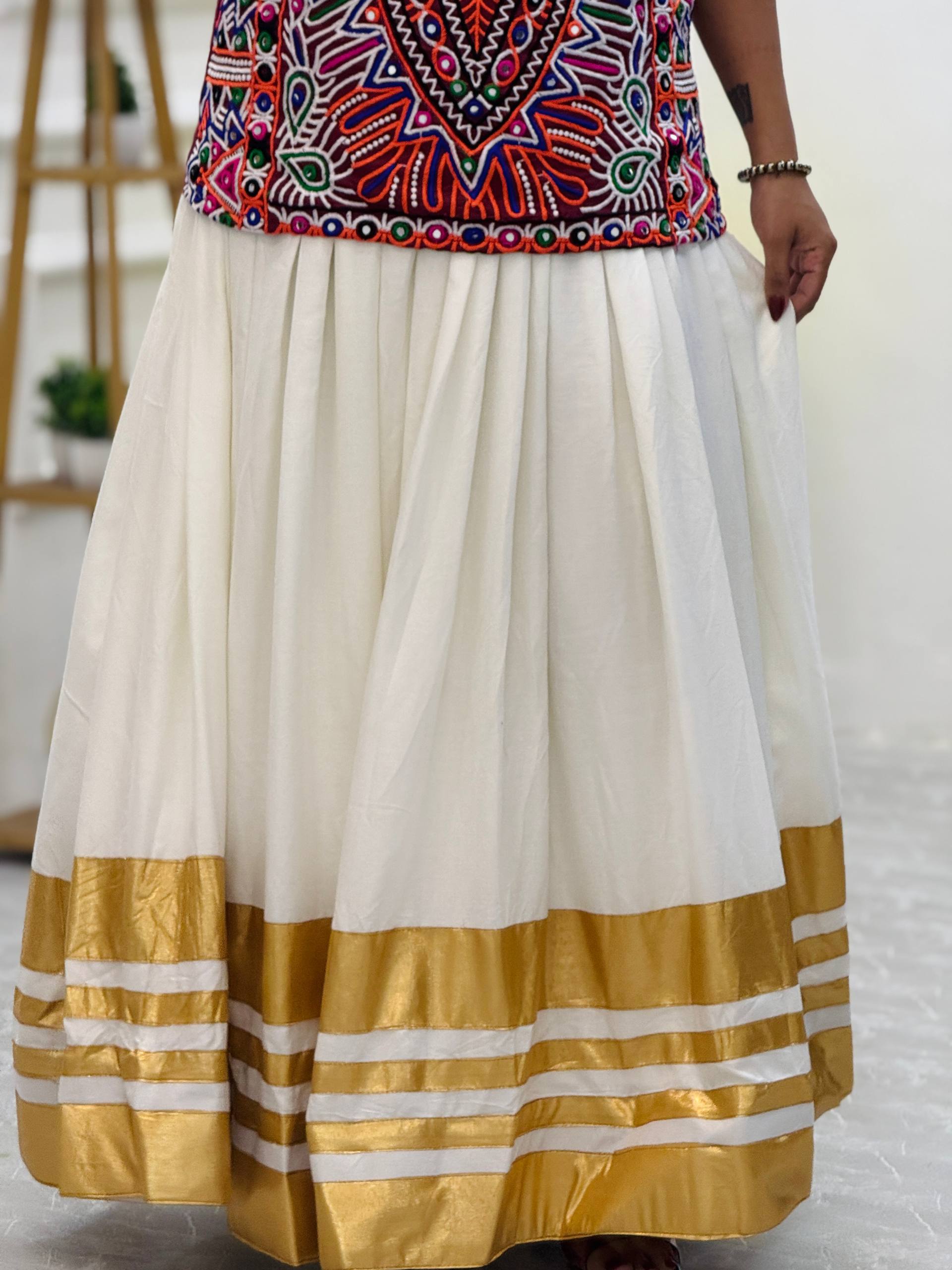 "Traditional White and Gold Lehenga Choli with Vibrant Kutchi Embroidered Blouse"