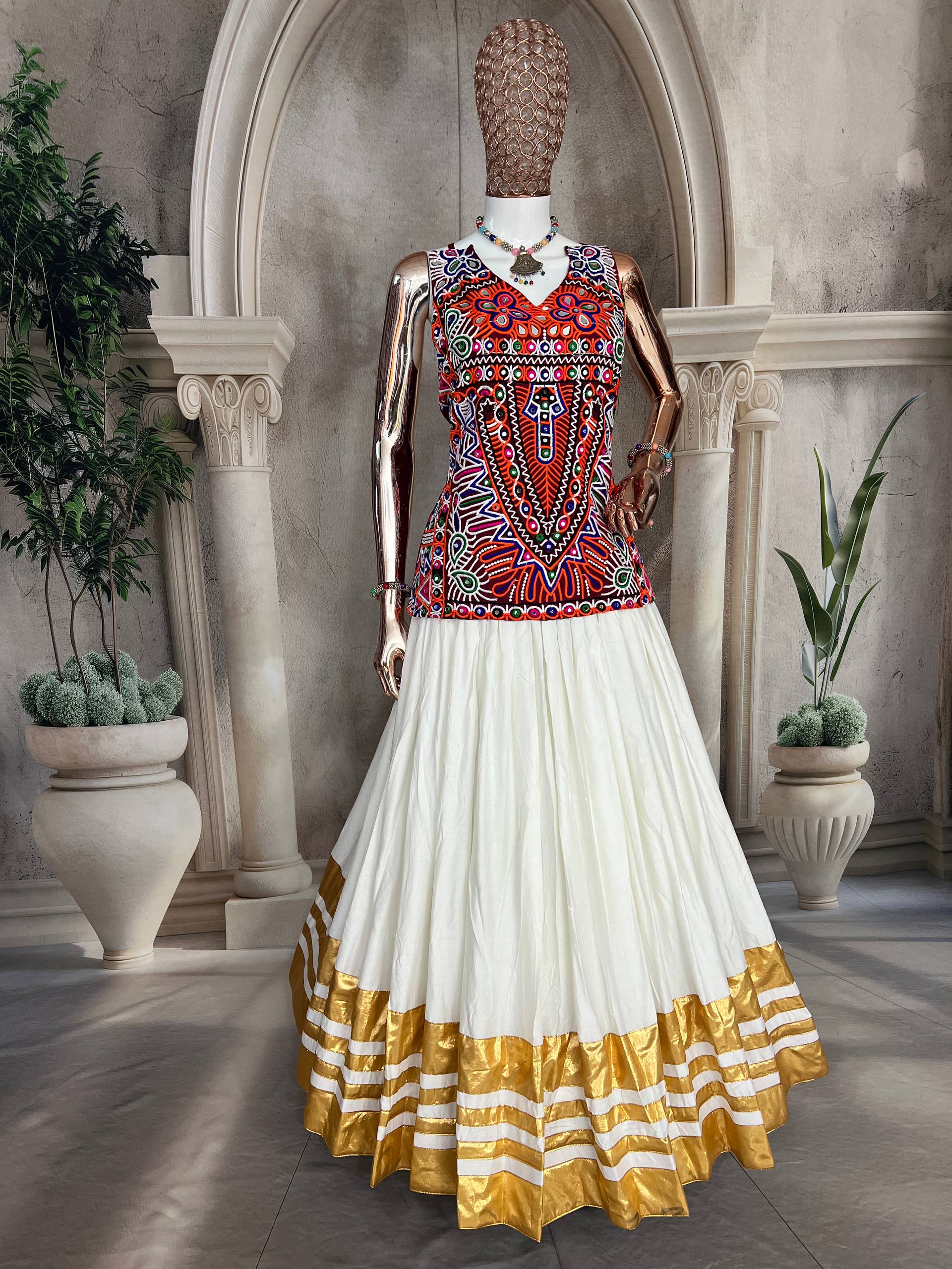 "Traditional White and Gold Lehenga Choli with Vibrant Kutchi Embroidered Blouse"